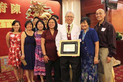 Rebecca, Shirley, James, Denise, Juliet, T, Gene, Kee, and Gary showing our guests the President's award in a gold frame from our children and their spouses.